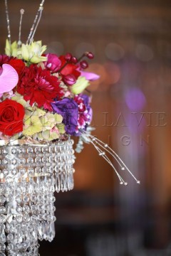 Elegant floral arrangement with crystal accents and vibrant colors.