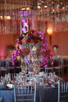 Elegant floral centerpiece with vibrant flowers at a formal event.