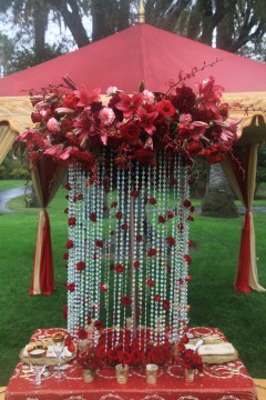 Elegant floral and bead curtain decoration at an event.