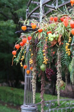 Colorful hanging floral decorations outdoors.