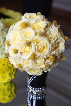 Elegant cream and yellow floral bouquet with pearl accents.