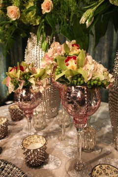 Elegant floral arrangement in vintage glassware with soft lighting.