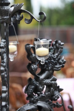 Incense burning atop a dragon-shaped holder with smoke rising.