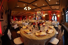 Elegant banquet hall with round tables set for a formal event.